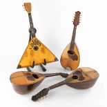 Three mandolines and a Balalaika. 20th C. (D:43 x W:67 x H:12 cm)