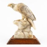 Calendi, e figurine of an eagle, sculptured alabaster. (D:17 x W:29 x H:36 cm)