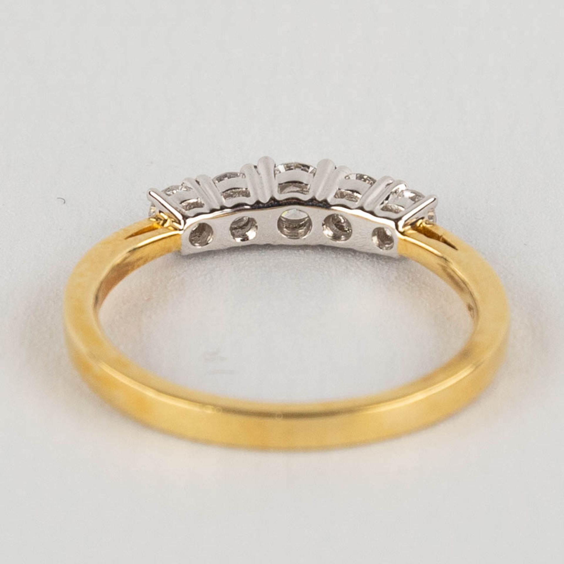 A ring, 18kt yellow and white gold with 5 diamonds, appr. 0,52ct. Ring size 54. - Image 6 of 11