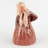 Desvres, France, a figurine of an old lady. Glazed faience, Monogram G. F. (D:18 x W:16 x H:28 cm)