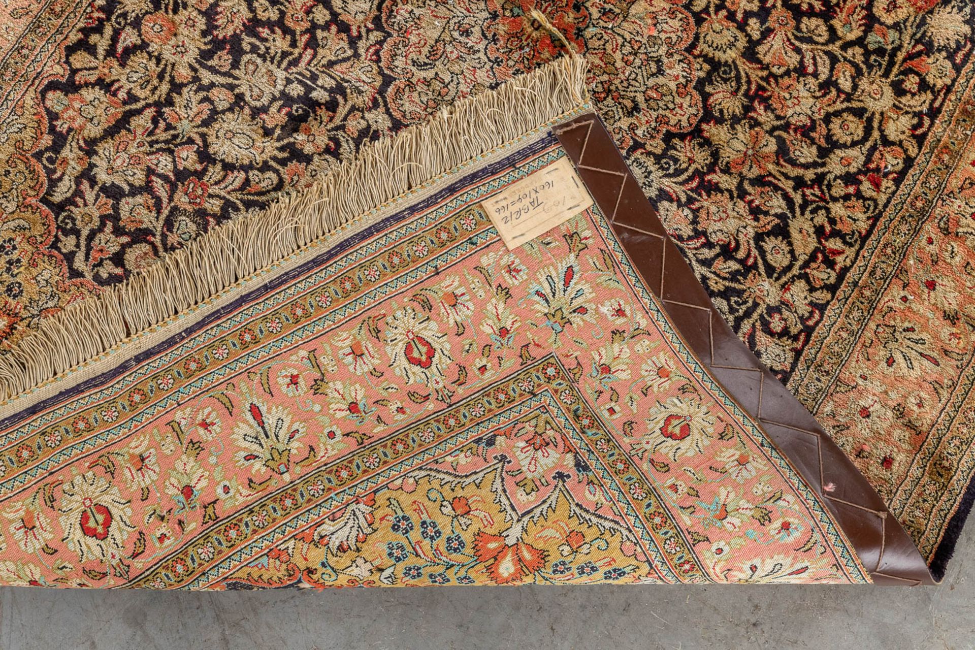 An Oriental hand-made carpet, silk and wool, Tabriz. (D:104 x W:160 cm) - Image 9 of 10