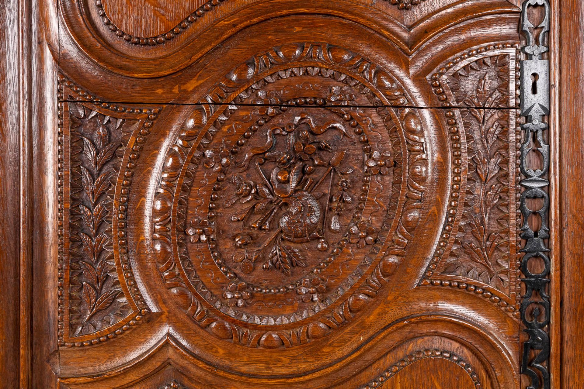 A richly sculptured and antique Normandy high cabinet, Armoire. France, 18th C. (D:68 x W:175 x H:23 - Image 6 of 21