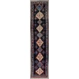 An antique Oriental carpet, runner, Hamadan, Iran. (D:500 x W:111 cm)