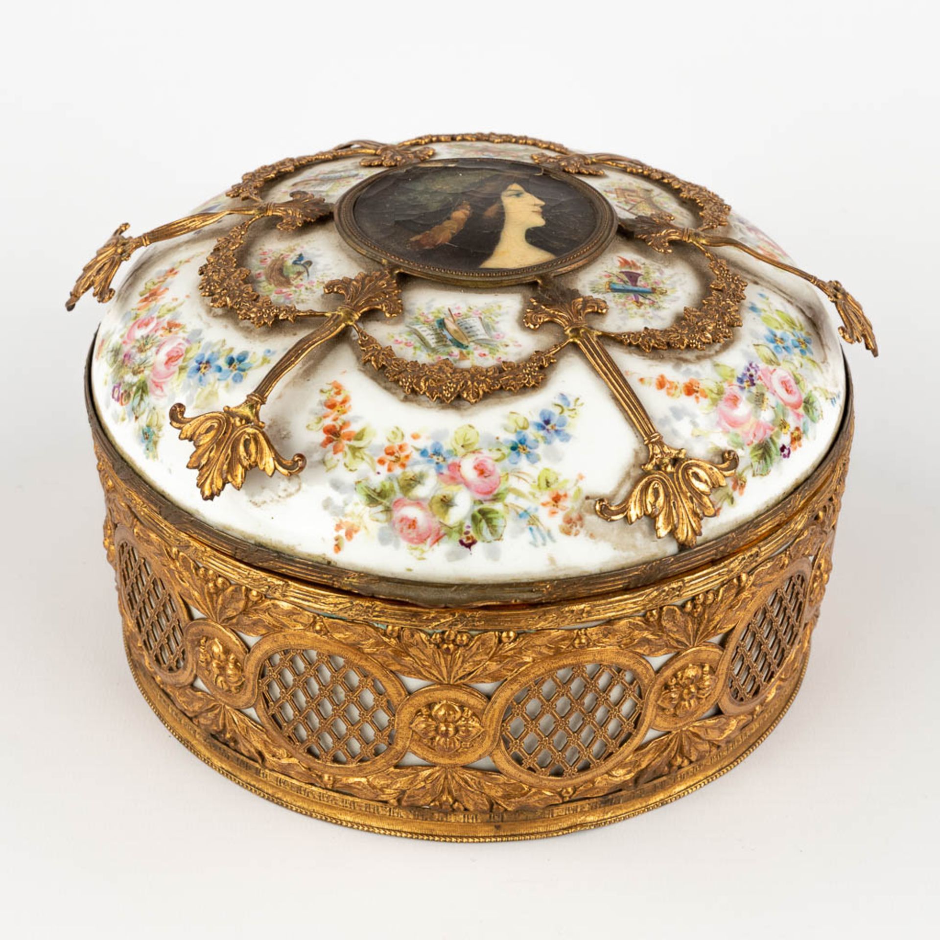 A porcelain Jewelry box, porcelain mounted with bronze. hand-painted flower decor. (H:12 x D:21 cm)