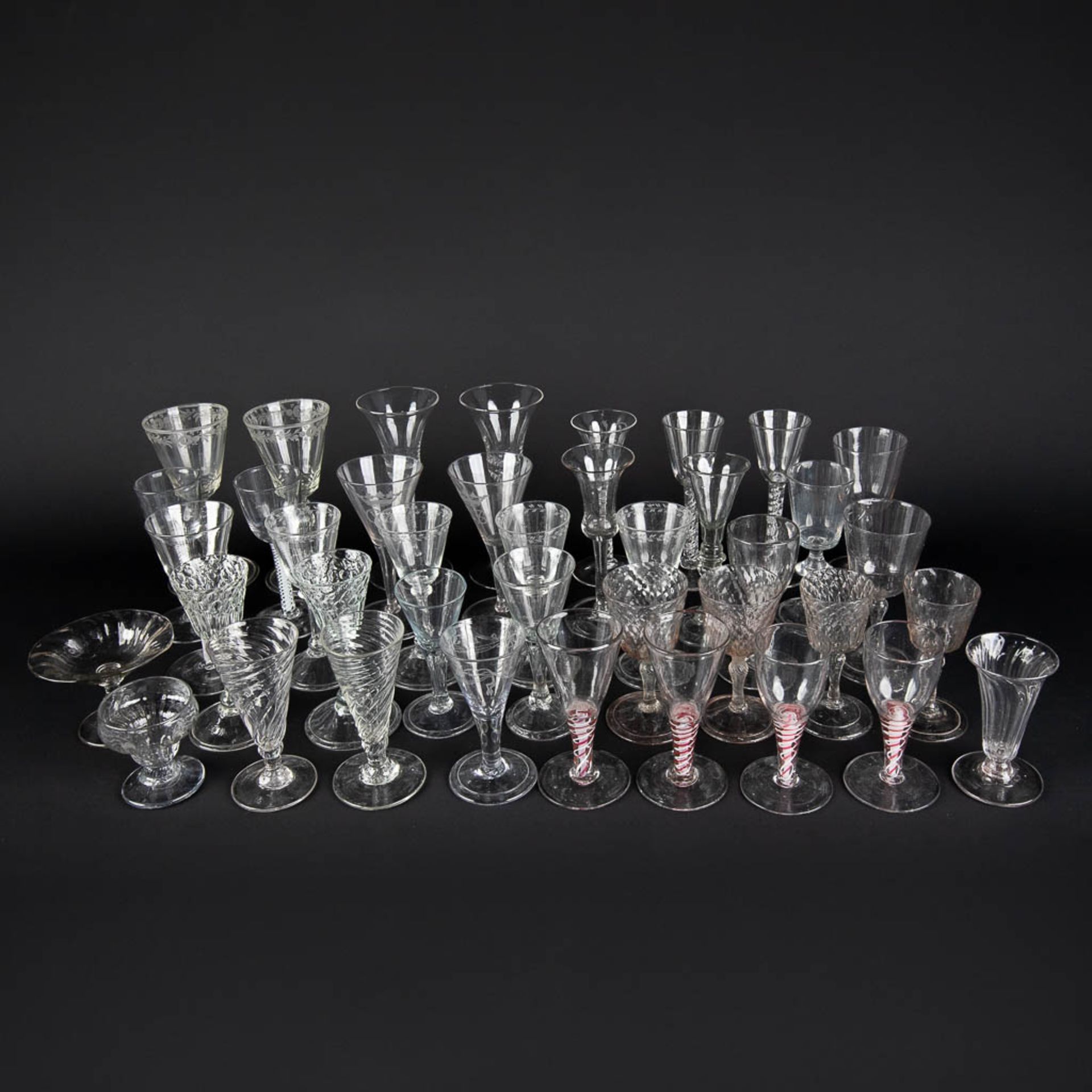 A large collection of antique glasses, Spiraalglazen. 18th/19th C. (H:18 cm)