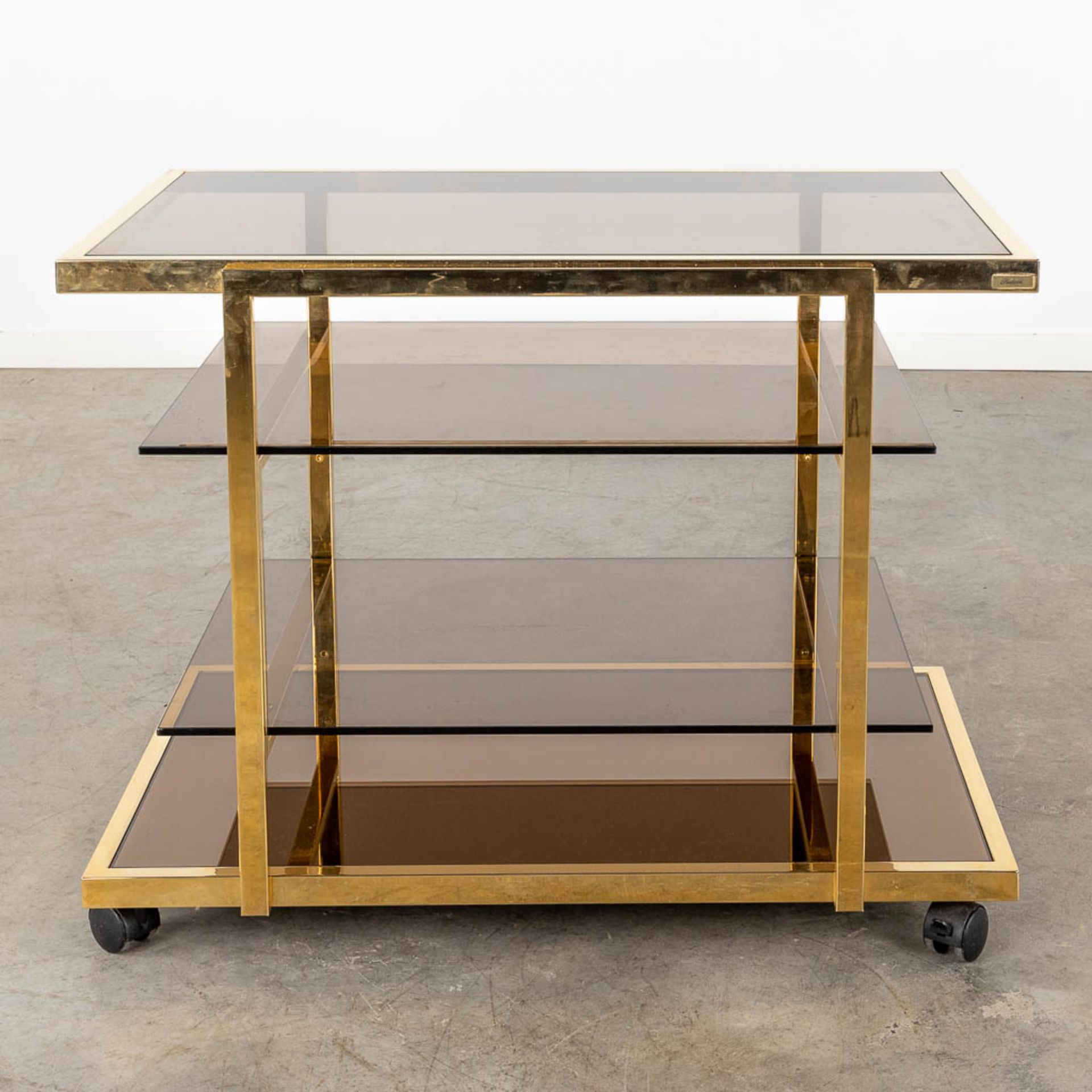 Fedam, a four tier bar cart, gilt metal and tinted glass. Circa 1970 (D:53 x W:85 x H:66 cm) - Image 5 of 8