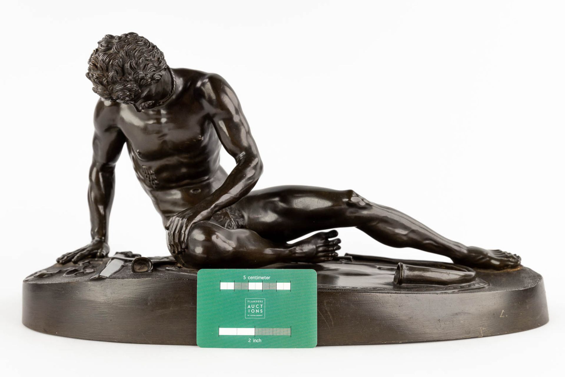 After an antique statue 'The Dying Gaul' patinated bronze. 19th/20th C. (D:21 x W:46 x H:24 cm) - Image 2 of 11