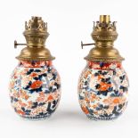 A pair of Chinese export Imari vases, rebuilt as oil lamps. 18th/19th C. (H:25 cm)