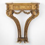 A console table with ram's heads, gilt and sculptured wood and a Carrara marble top. 19th C. (D:41 x