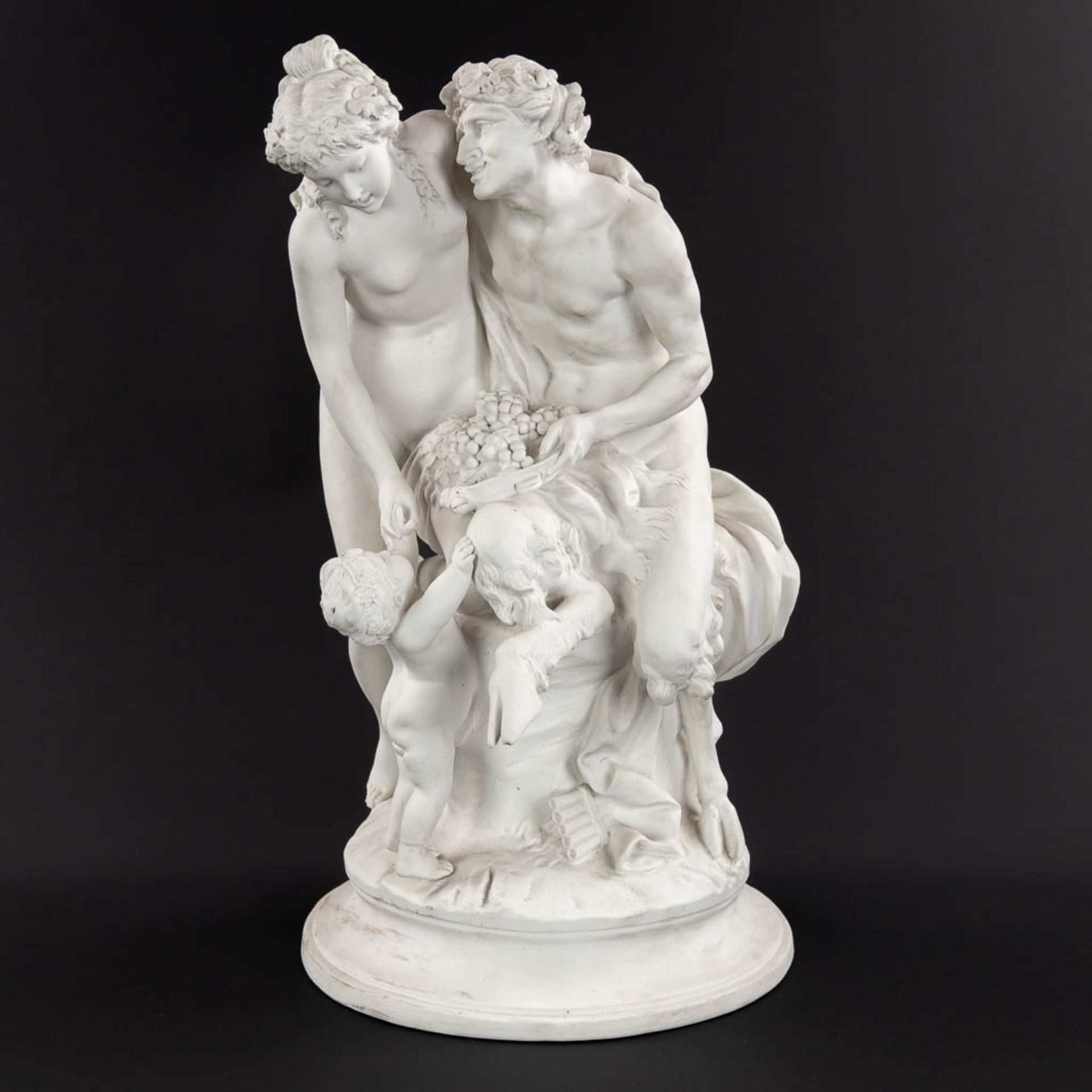 CLODION (1738-1814)(after) 'Satyr, Nymph and putto' bisque porcelain, marked Sèvres. (H:43 x D:25 cm