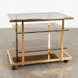 Fedam, a four tier bar cart, gilt metal and tinted glass. Circa 1970 (D:53 x W:85 x H:66 cm)