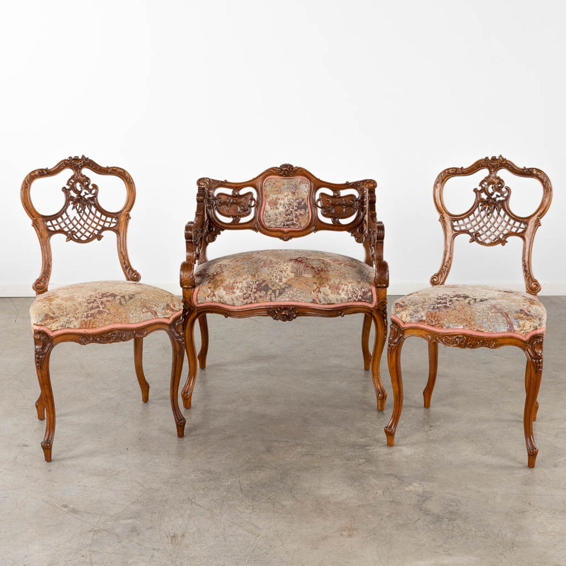 An antique 3-piece salon suite, sculptured wood in Louis XV style. Circa 1900. (D:50 x W:70 x H:79 c