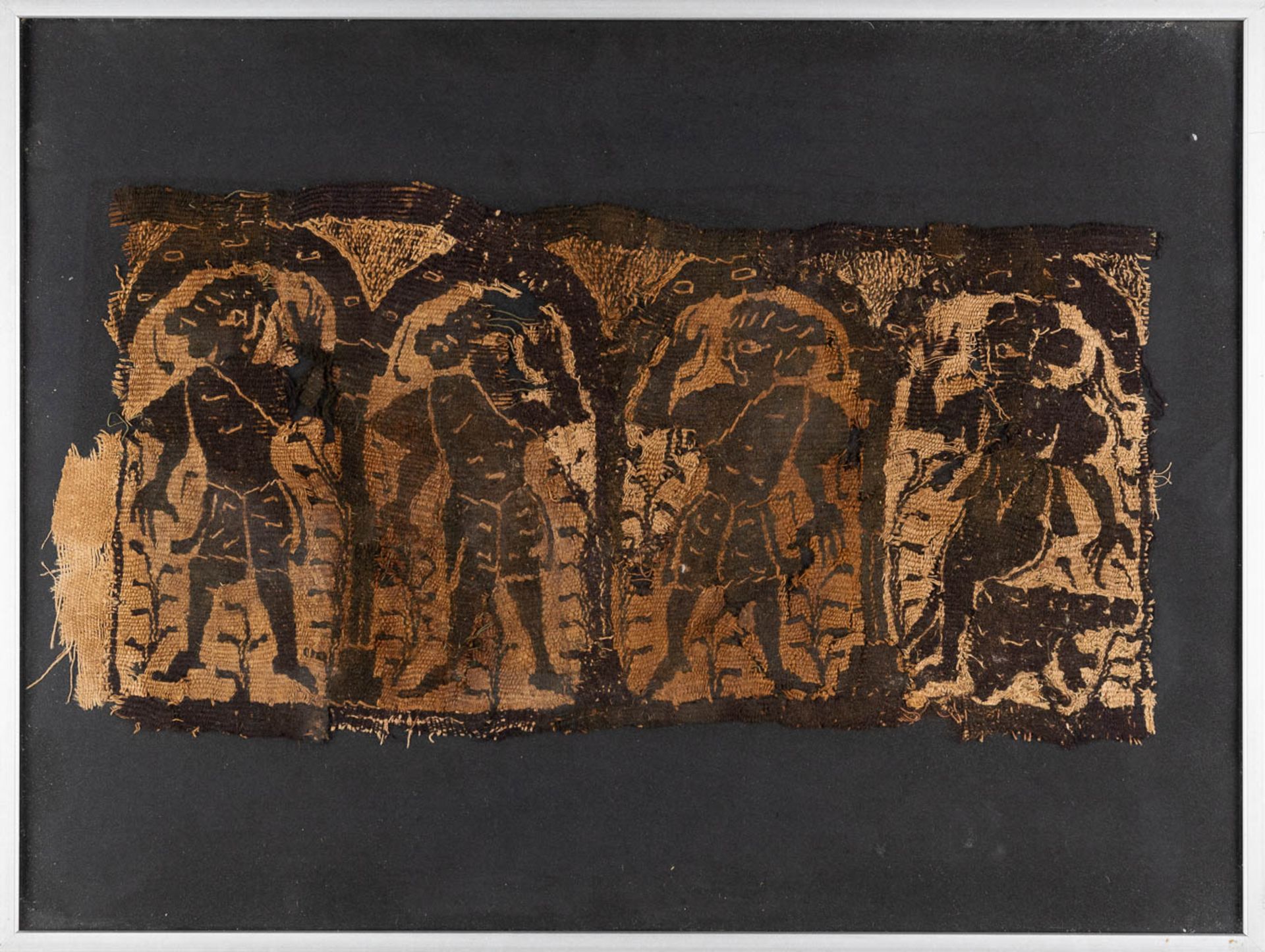 An antique fragment, woven fabric decorated with dancing figurines. Probably Koptic, 4th-6th C. (W:3
