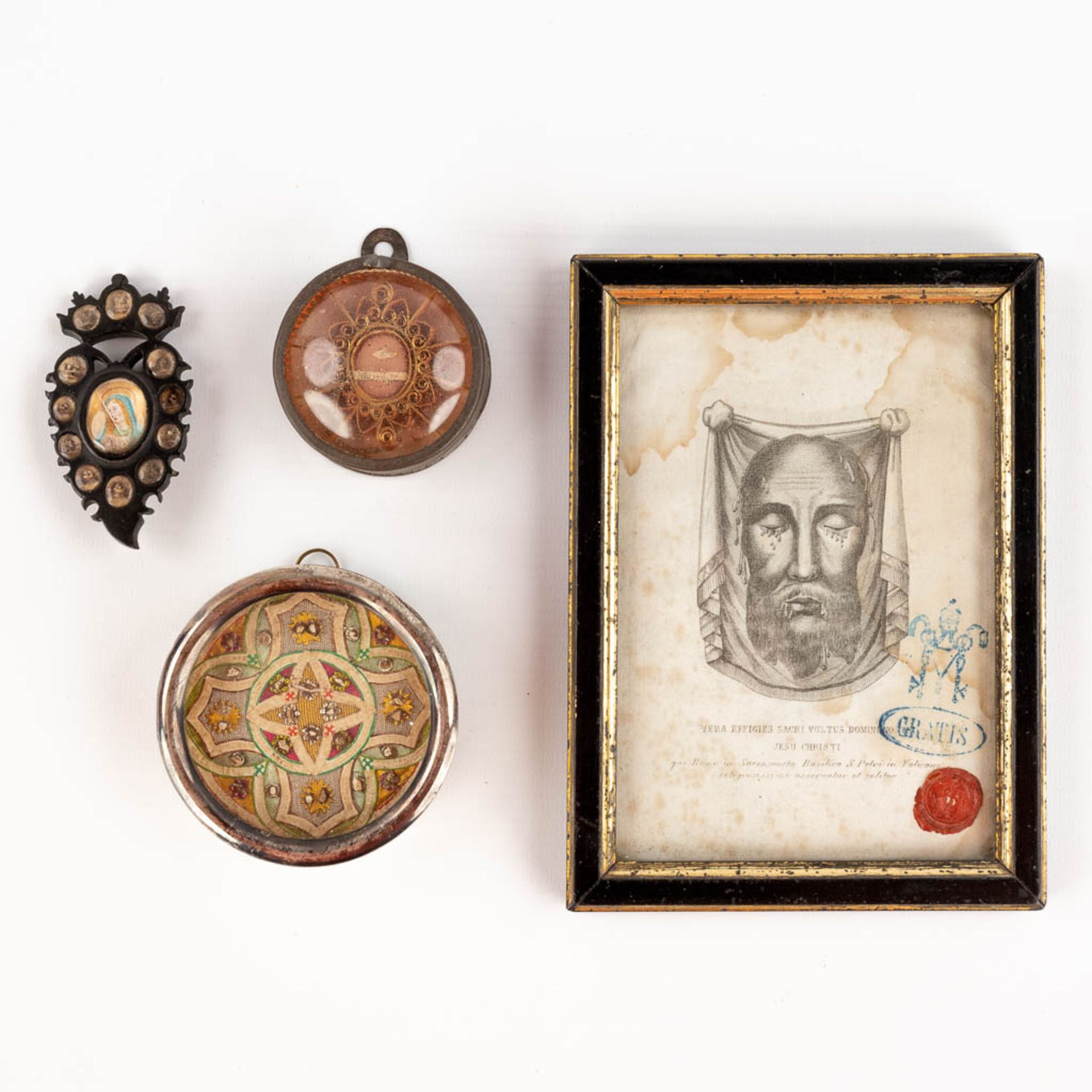 A small collection of relics and reliquary items, The Veil of Veronica, a relic in the shape of a sa