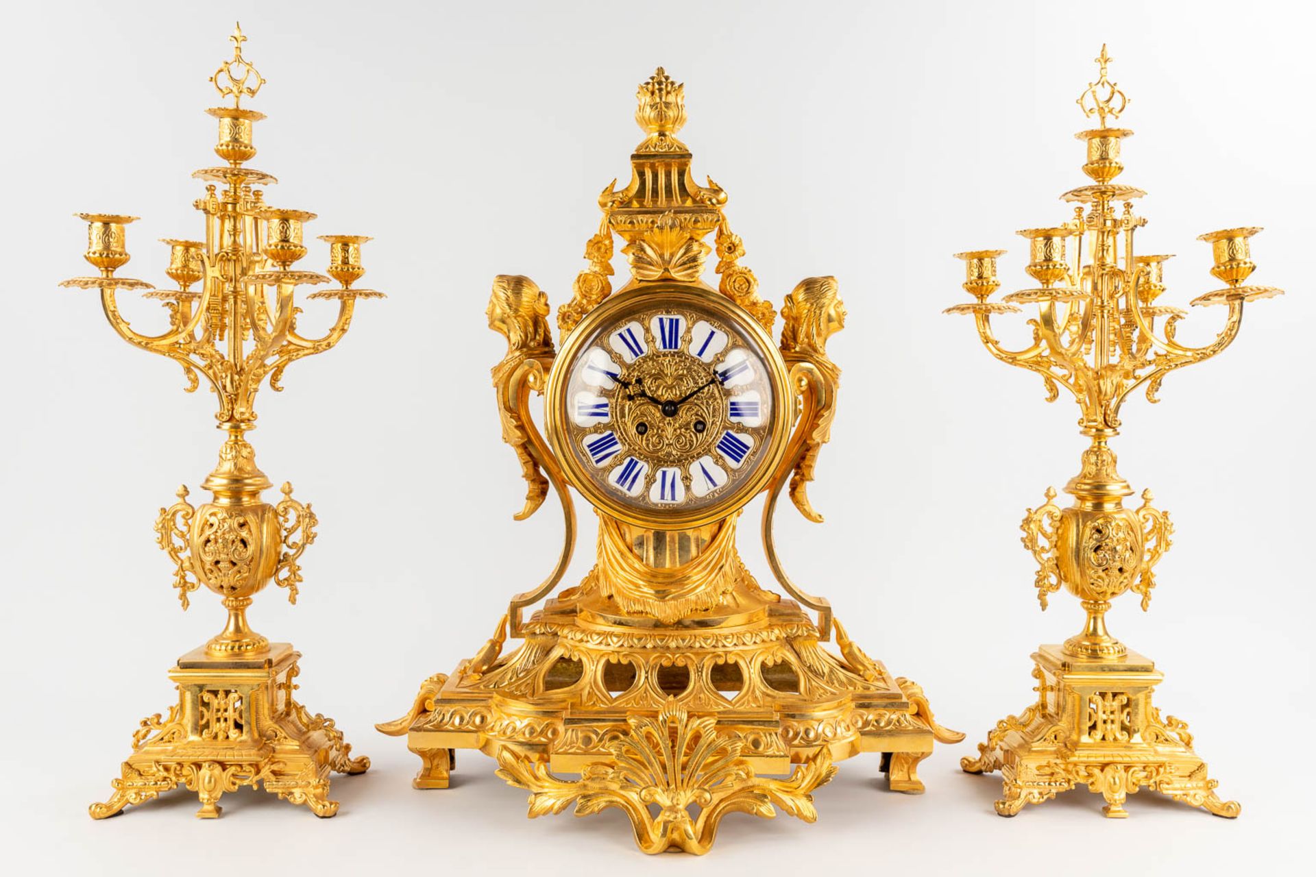 A three-piece mantle garniture clock and candelabra, gilt bronze in Louis XV style. 19th C. (D:28 x - Image 4 of 16