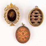 Three large and sealed theca with relics, Sacred Heart and others. (W:6 x H:8,5 cm)