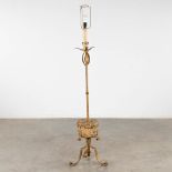 A wrought iron standing lamp with an antique stone mortar. (H:150 x D:35 cm)