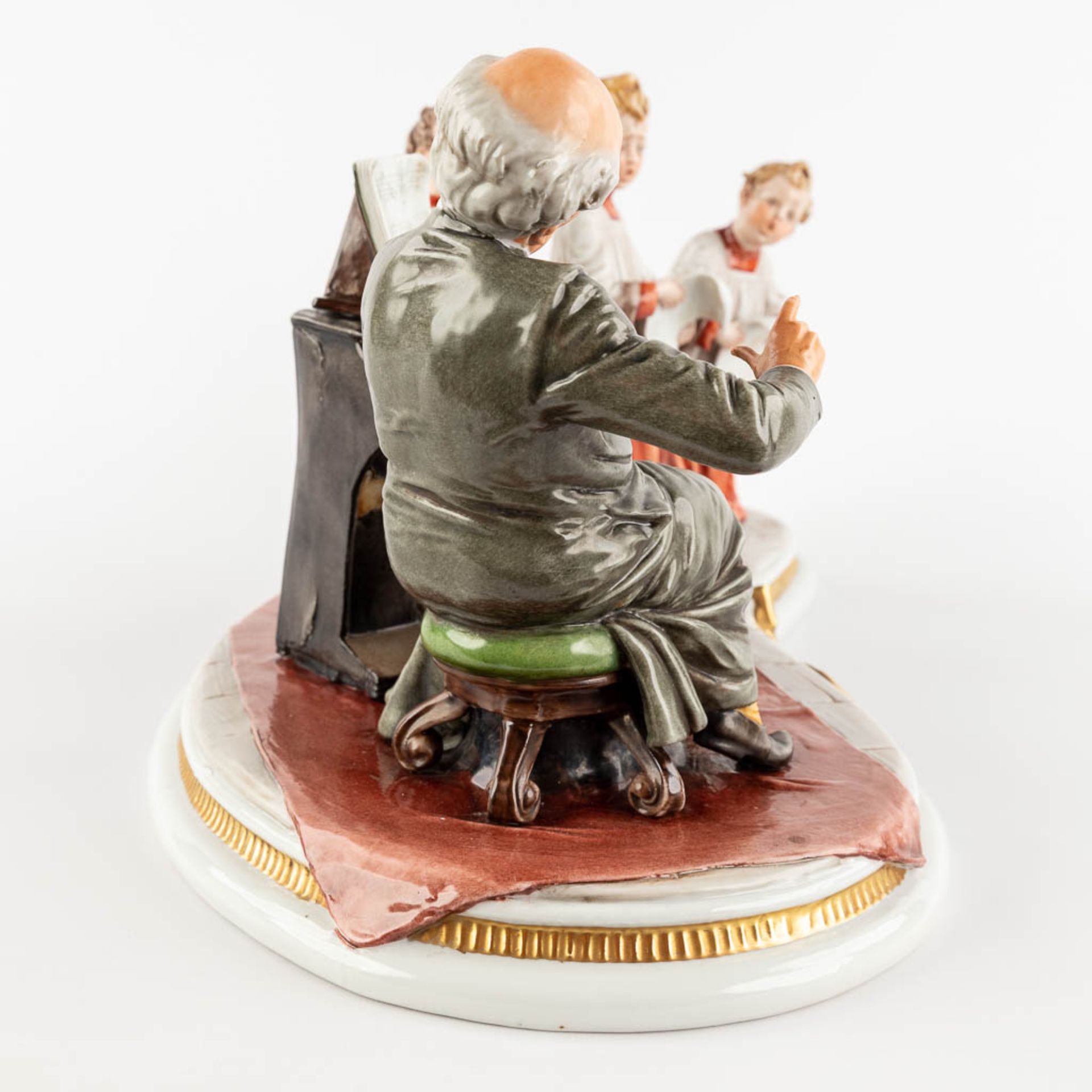 Capodimonte, 'Schola Cantoro', a porcelain group with a mechanical music box. 20th C. (D:23 x W:48 x - Image 4 of 18