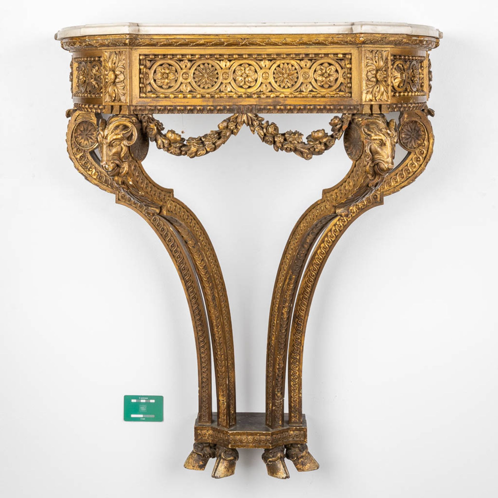 A console table with ram's heads, gilt and sculptured wood and a Carrara marble top. 19th C. (D:41 x - Image 2 of 15