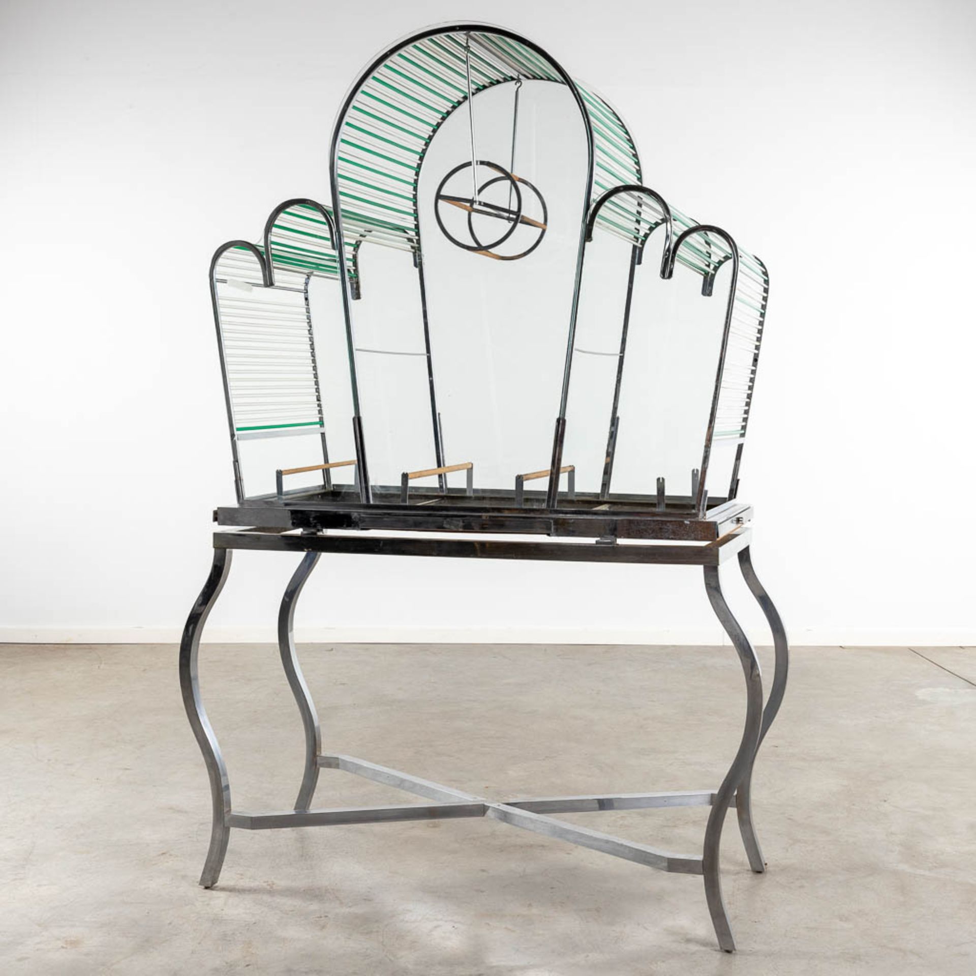 A large birdcage, chrome and glass, circa 1950. (D:53 x W:128 x H:186 cm)