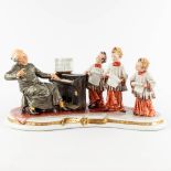 Capodimonte, 'Schola Cantoro', a porcelain group with a mechanical music box. 20th C. (D:23 x W:48 x