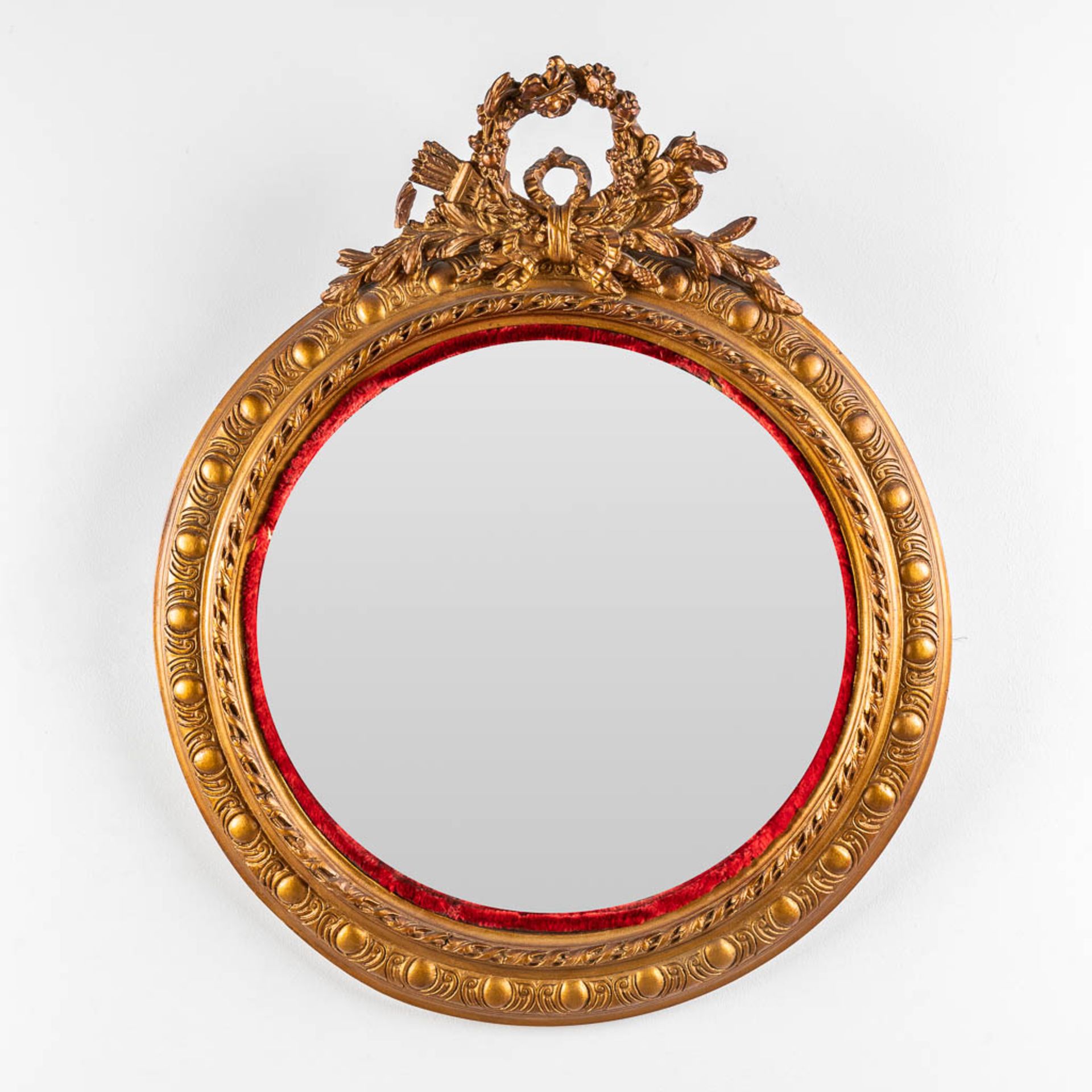 An antique round mirror, Louis XVI style. 19th C. (W:64 x H:76 cm)