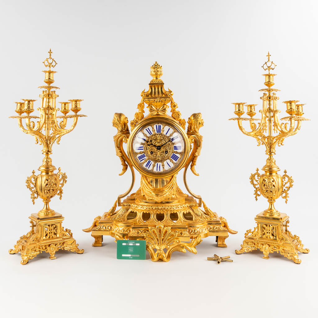 A three-piece mantle garniture clock and candelabra, gilt bronze in Louis XV style. 19th C. (D:28 x - Image 2 of 16