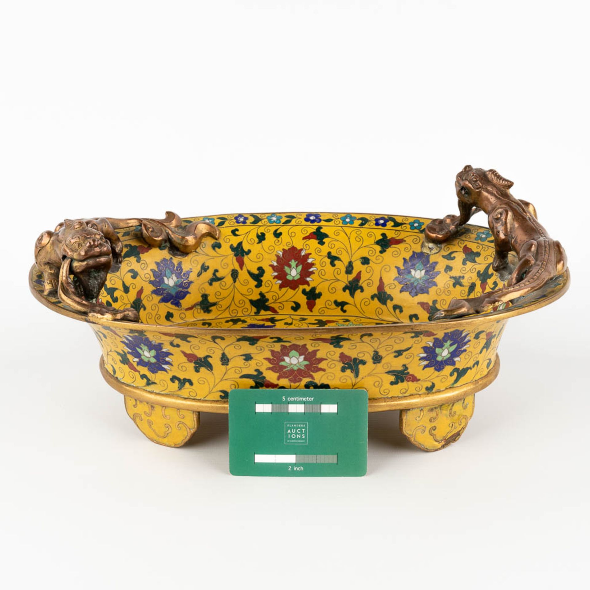 A Chinese cloisonné bronze bowl, mounted with dragons and finished with floral decor. (D:25,5 x W:36 - Image 2 of 13
