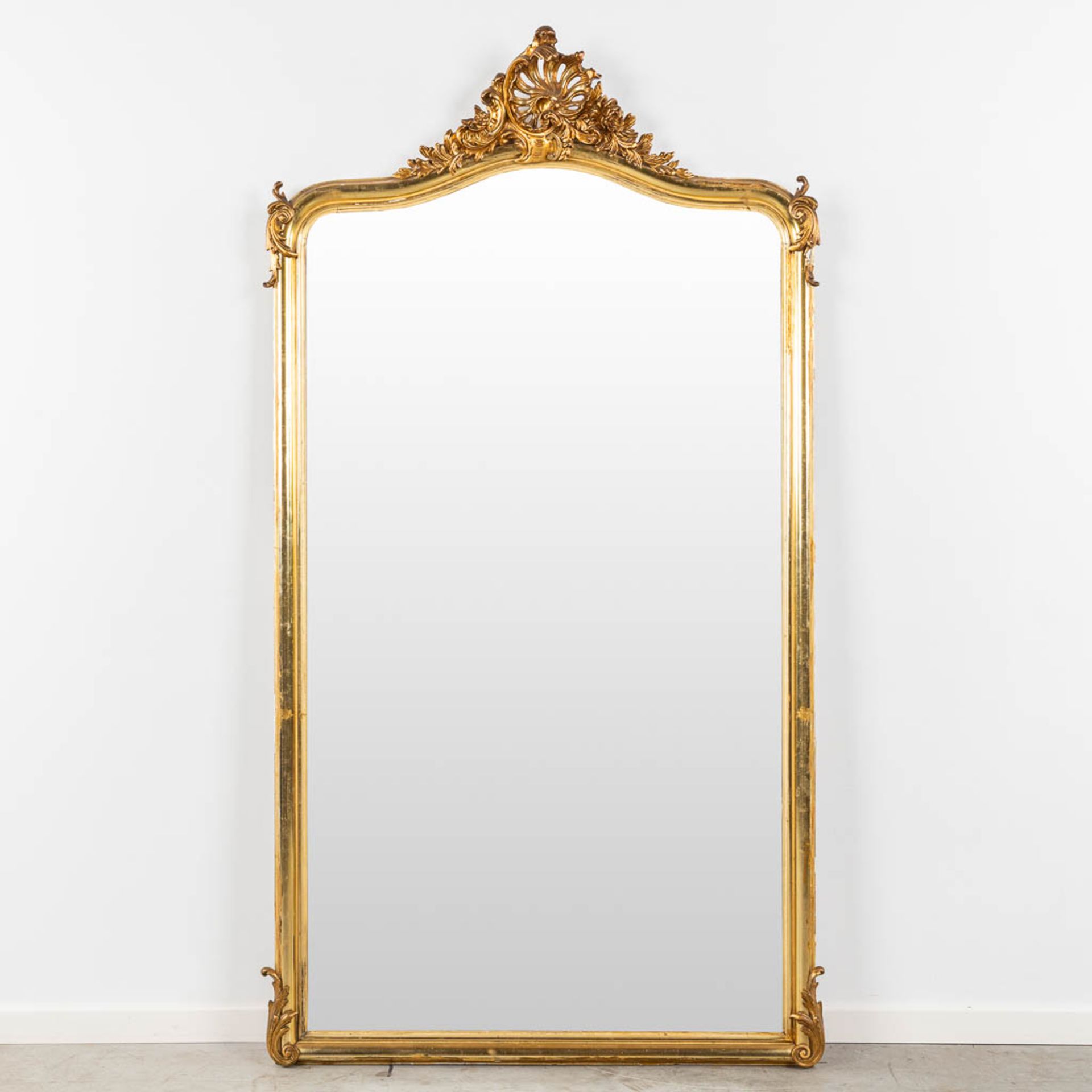 A mirror, gilt wood and stucco in Louis XV style. Circa 1900. (W:104 x H:180 cm)