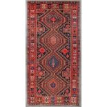 An Oriental hand-made carpet, Shirvan, Kaukasus. (D:305 x W:149 cm)