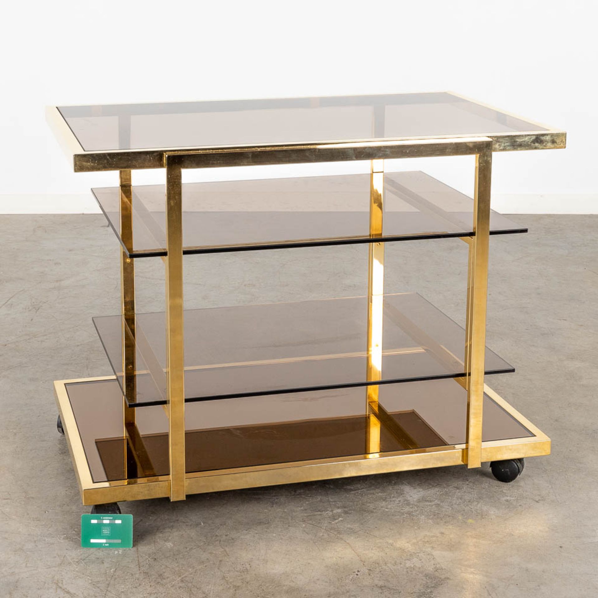 Fedam, a four tier bar cart, gilt metal and tinted glass. Circa 1970 (D:53 x W:85 x H:66 cm) - Image 2 of 8