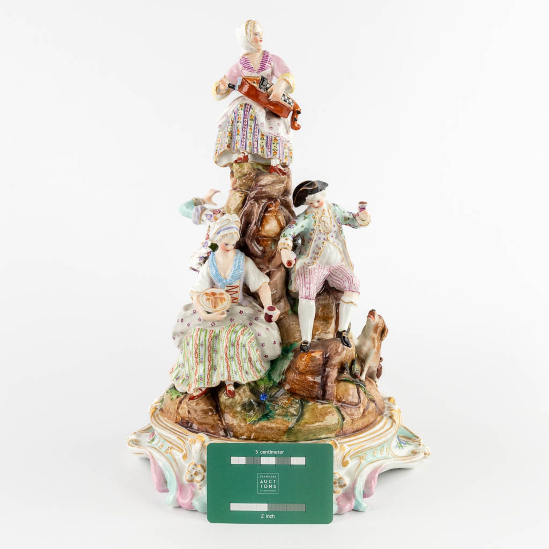 A large polychrome porcelain group with a 'Hurdy Gurdy'. 19th C. (D:22 x W:25 x H:34 cm) - Bild 2 aus 18