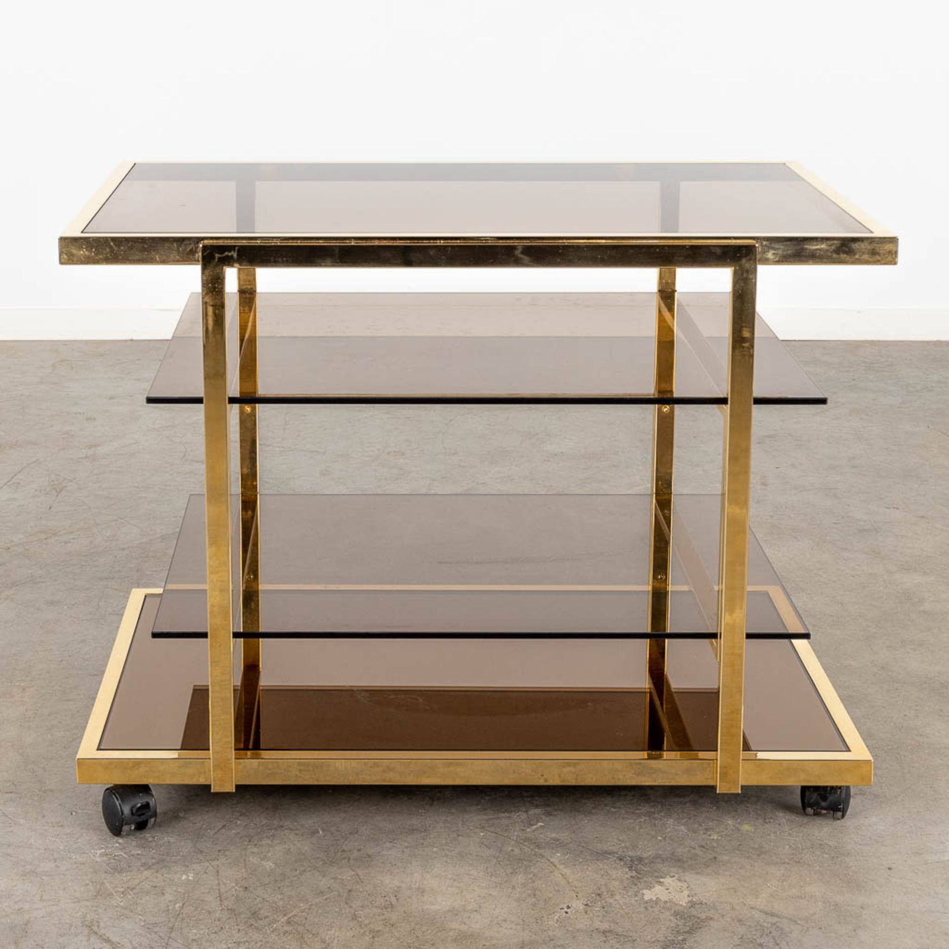 Fedam, a four tier bar cart, gilt metal and tinted glass. Circa 1970 (D:53 x W:85 x H:66 cm) - Image 3 of 8