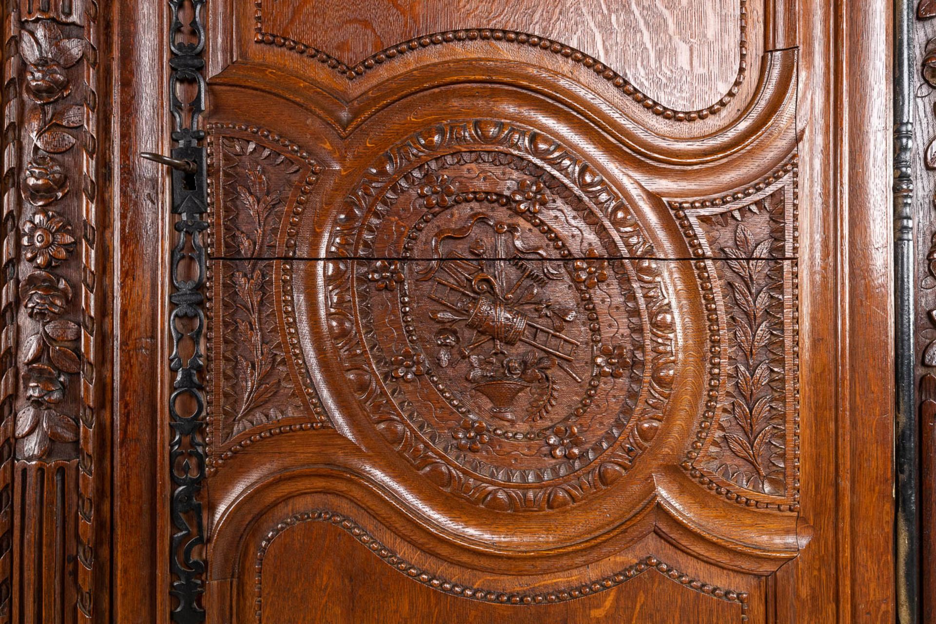 A richly sculptured and antique Normandy high cabinet, Armoire. France, 18th C. (D:68 x W:175 x H:23 - Image 8 of 21