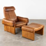 A mid-century lounge chair with ottoman, leather. (D:86 x W:90 x H:96 cm)