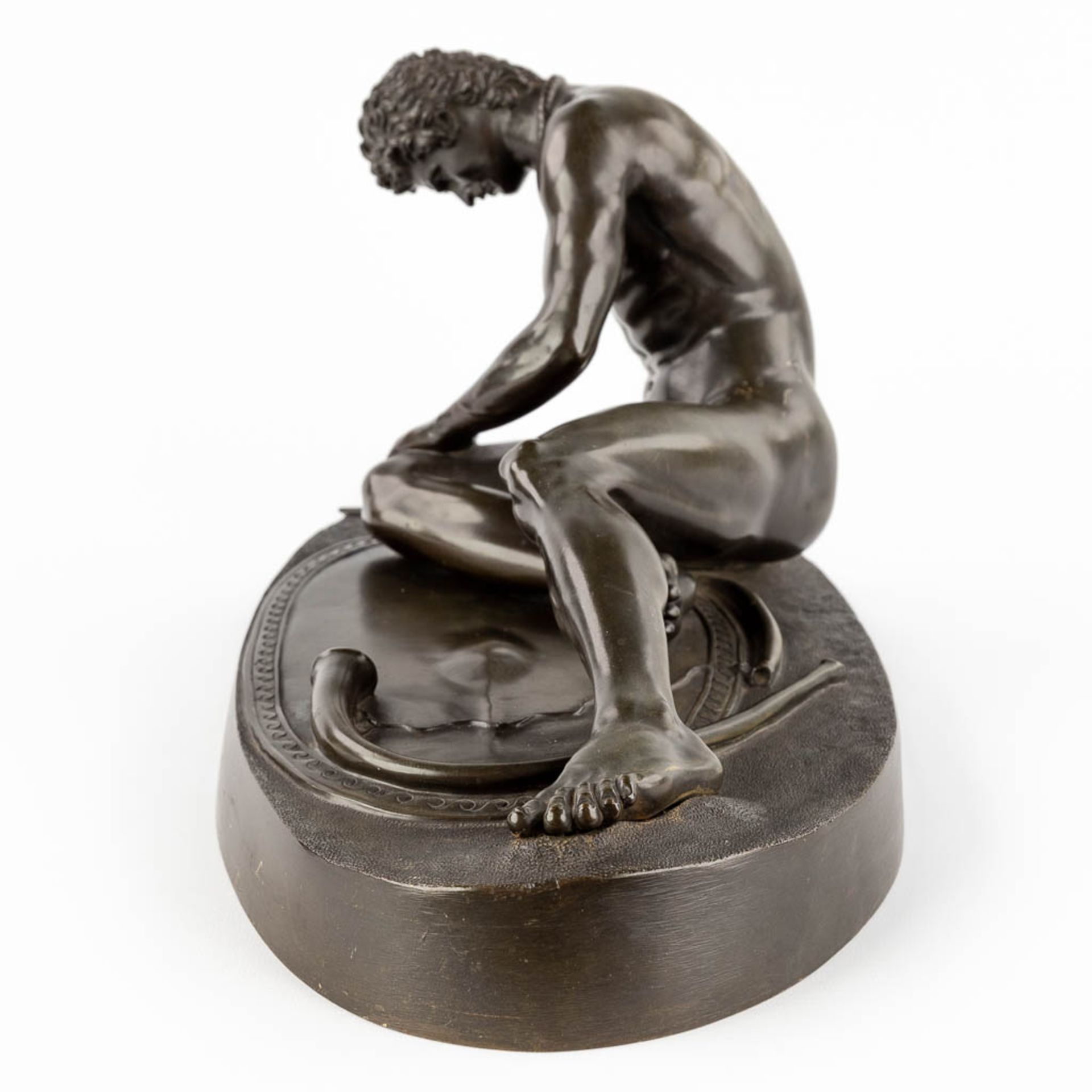 After an antique statue 'The Dying Gaul' patinated bronze. 19th/20th C. (D:21 x W:46 x H:24 cm) - Image 7 of 11