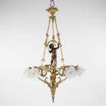 A ceiling lamp, gilt and patinated bronze, decorated with a putto and rose glass shades. 20th C. (H: