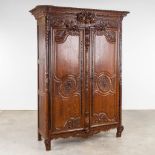 A richly sculptured and antique Normandy high cabinet, Armoire. France, 18th C. (D:68 x W:175 x H:23