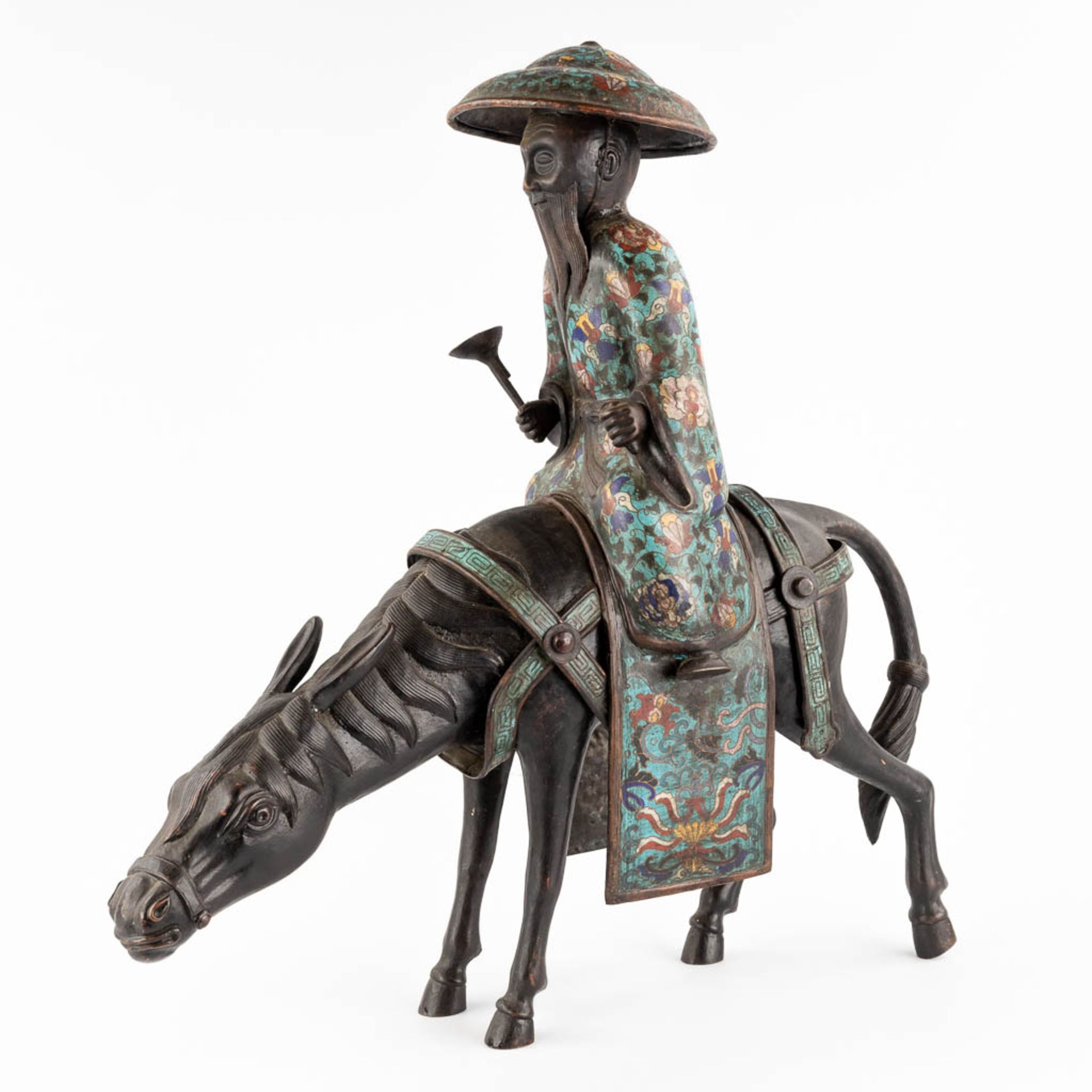 A Japanese figure of Lao Zi seated on a mule, Champslevé bronze. Possibly Meji period. (D:18 x W:55 