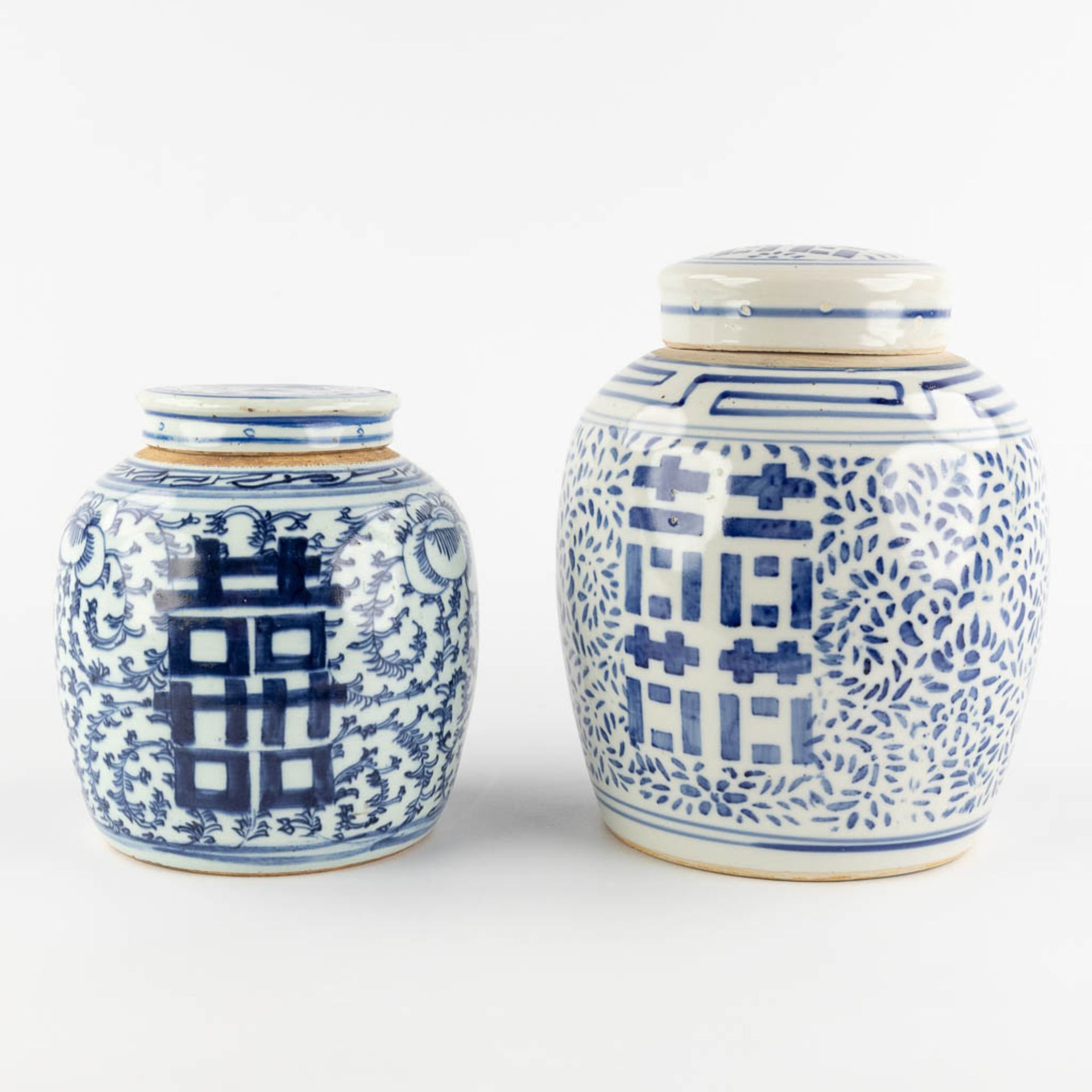 Two Chinese ginger jars with a blue-white decor of Happiness, Double Xi sign. 19th/20th C. (H:27 x D