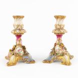 A pair of polychrome porcelain candlesticks or candle holders. (D:10 x W:10 x H:17 cm)