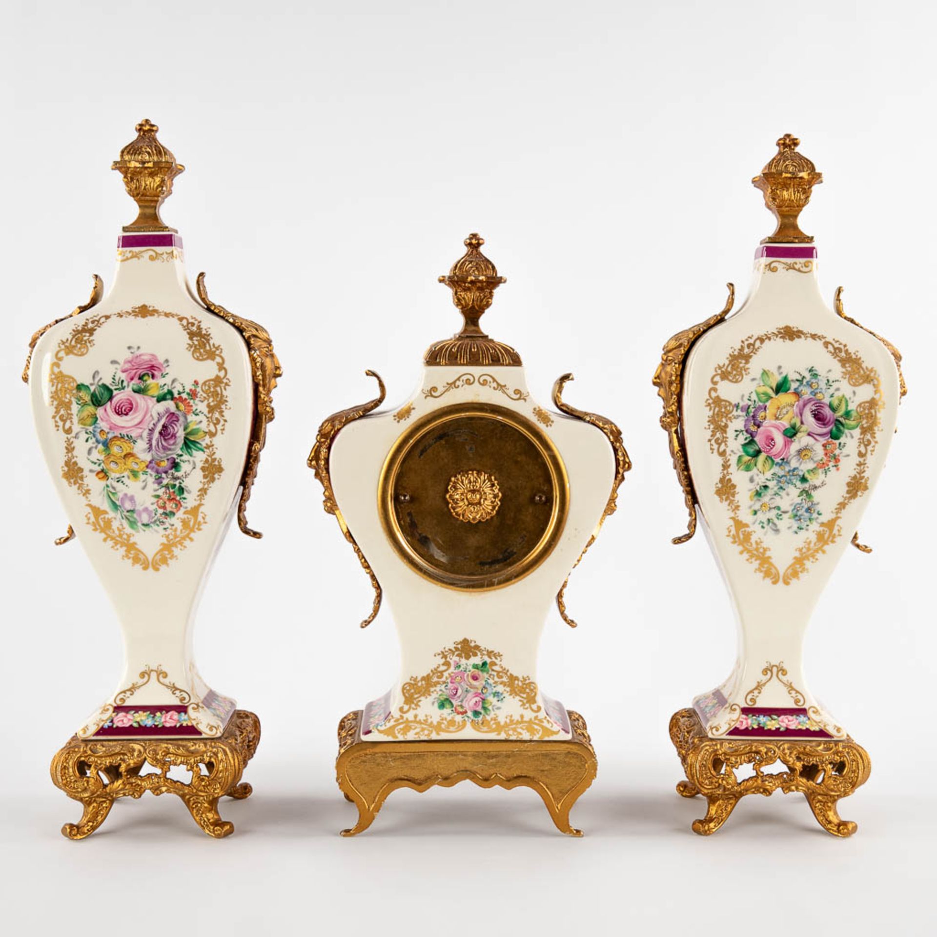 A three-piece mantle garniture clock and side pieces, porcelain mounted with bronze and floral decor - Image 5 of 14