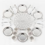 Christofle, 8 knife rests, 6 napkin rings, 6 trays and 1 trivet, silver-plated metal. (D:20 cm)