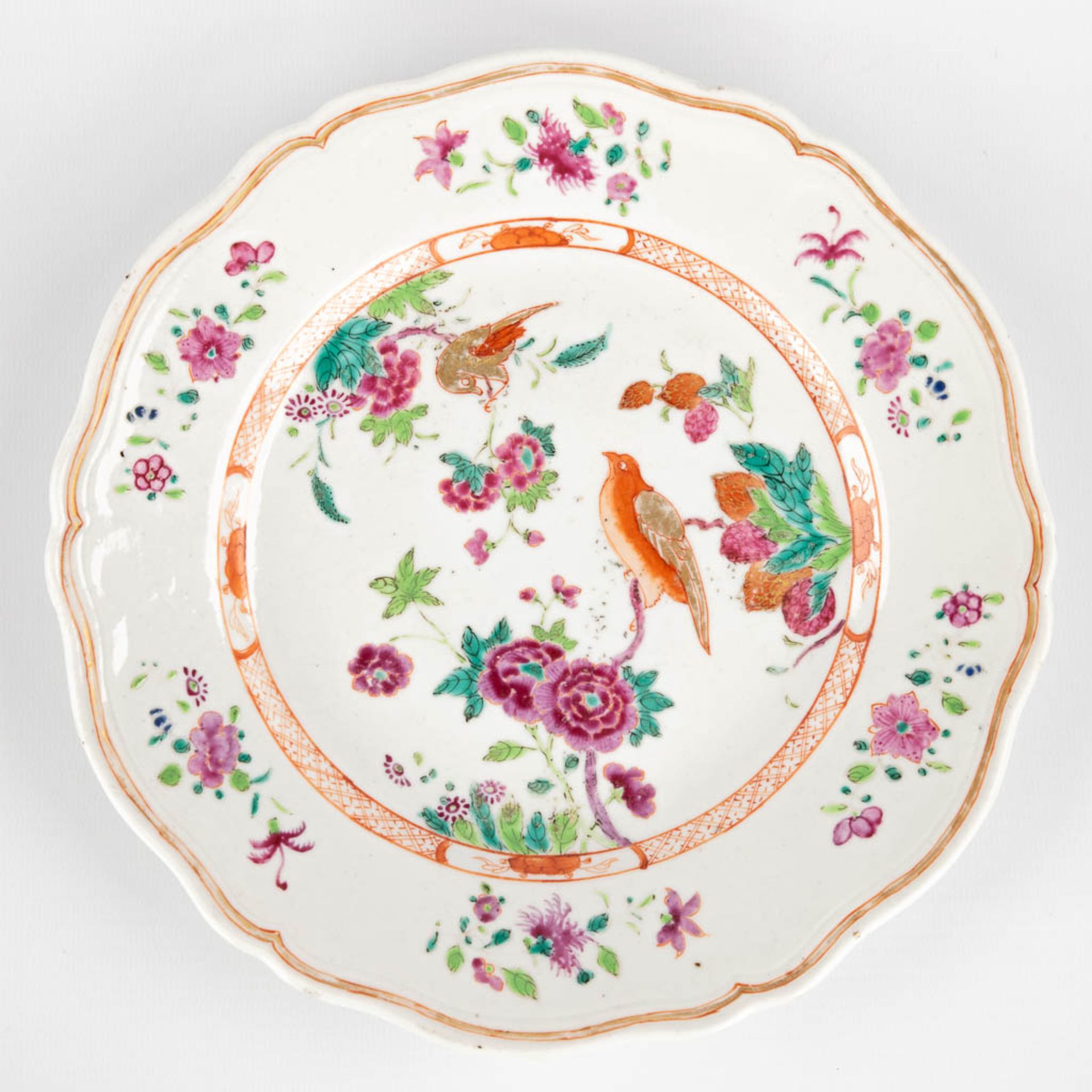 Three Chinese Famille Rose plates, decorated with fauna and flora. 19th/20th C. (D:23,5 cm) - Image 6 of 9