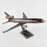 A decorative statue of an aeroplane. Metal. 20th C.  (D:67 x W:69 x H:36 cm)