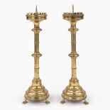 A pair of Church candlesticks, bronze in gothic revival style and standing on claw feet. (H:65 cm)