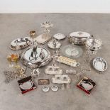 A large collection of silver-plated serving accessories.