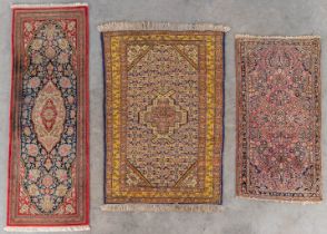 Three Oriental hand-made carpets, Sarough, Ghoum and Senehbaff. (D:168 x W:58 cm)