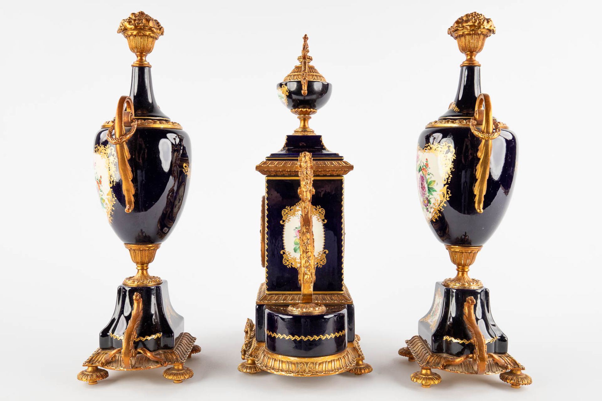 A.C.F. A three-piece mantle garniture clock and side pieces, cobalt blue porcelain mounted with bron - Image 6 of 14