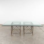 A table with large glass top and a wrought-iron and brass base. (D:120 x W:220 x H:74 cm)